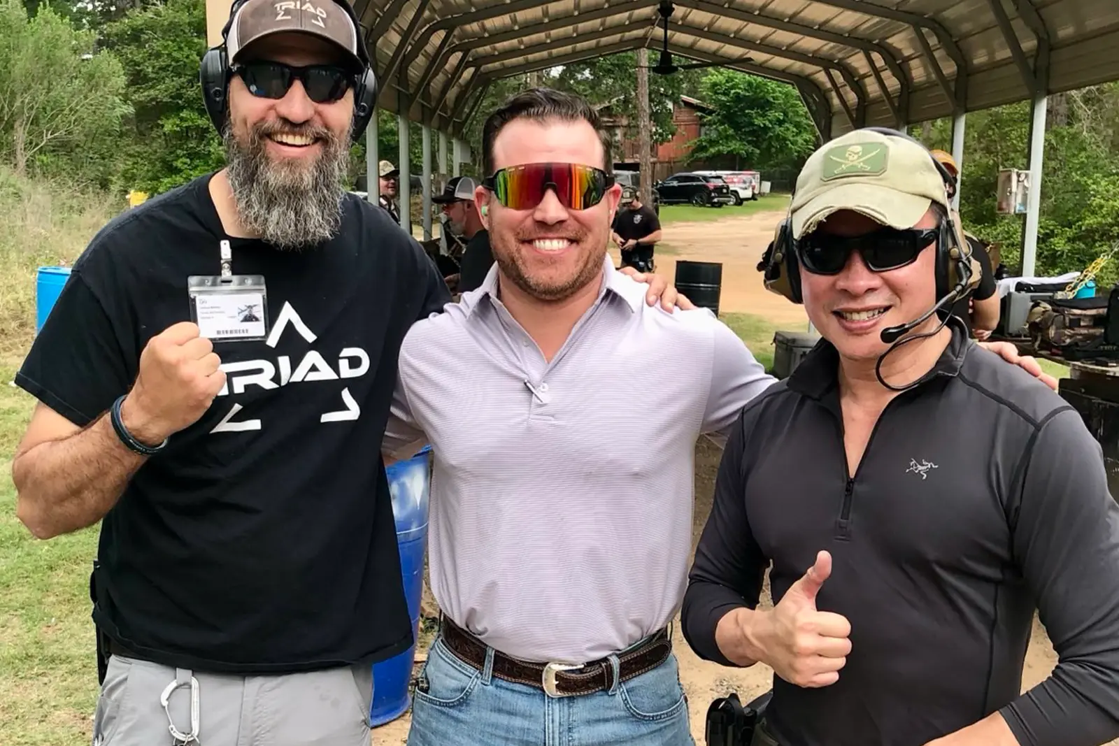 Nick Tran in group photo at gun range